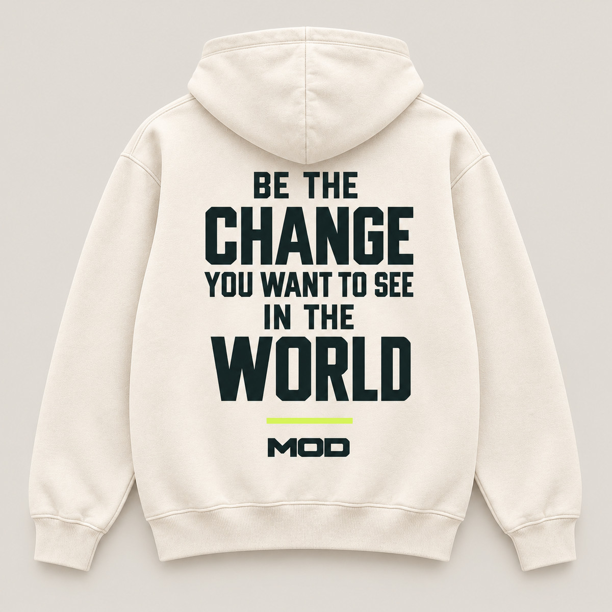 Concept ivory hoodie, back view, with “Be the Change You Want to See in the World” lettering and MOD below.