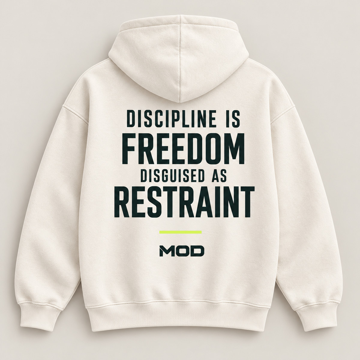 Concept ivory hoodie, back view, with “Discipline Is Freedom Disguised as Restraint” lettering and MOD below.