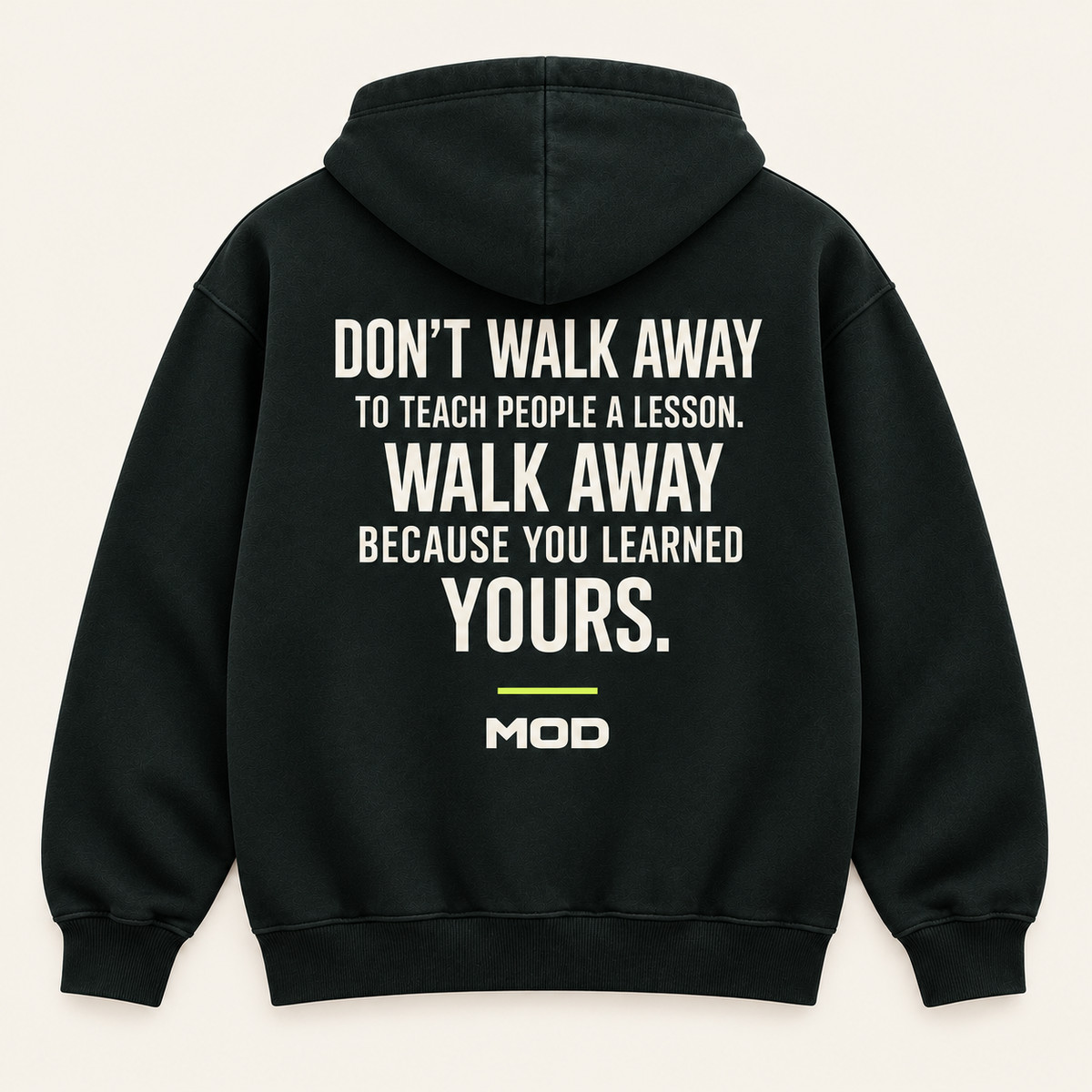 Concept ink hoodie, back view, with “Don’t Walk Away to Teach People a Lesson. Walk Away Because You Learned Yours.” lettering and MOD below.