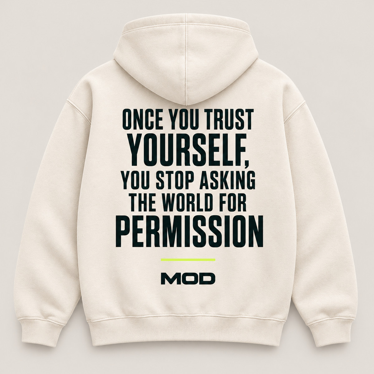 Concept ivory hoodie, back view, with “Once You Trust Yourself, You Stop Asking the World for Permission” lettering and MOD below.