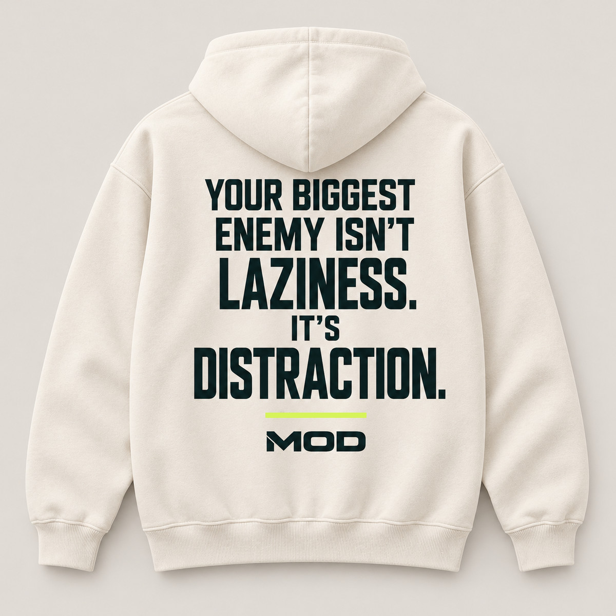 Concept ivory hoodie, back view, with “Your Biggest Enemy Isn’t Laziness. It’s Distraction.” lettering and MOD below.
